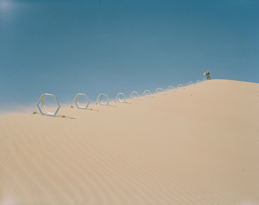 Line of markers traced down a dune face, Glamis, wide view